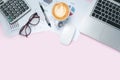 Pink office desk table with laptop computer, eyeglasses, mouse, calculator,pen,analysis chart or graph and cup of coffee Royalty Free Stock Photo