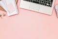 Pink office desk table with laptop and copy space Royalty Free Stock Photo
