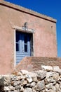 Pink old house with blue shutters and door on the island Susak Royalty Free Stock Photo