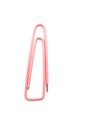 Pink old paper clip isolated Royalty Free Stock Photo