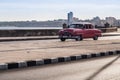 Pink classical car on the Malecon