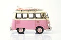 Pink old toy car with surfboard. Royalty Free Stock Photo