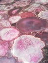 Pink onyx polished flat background. Onyx emotional stability, courage.