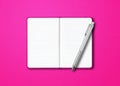 Pink open notebook with a pen isolated on colorful background Royalty Free Stock Photo