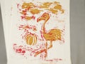 Pink and orange flamingo print on paper