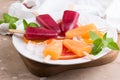 Pink and orange popsicle with red oranges on grey stone background. Royalty Free Stock Photo