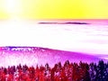 . Pink orange sun rise above misty winter mountains, shinning fog. Peaks of mountains Royalty Free Stock Photo