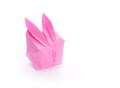 Pink origami bunny on white