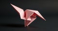 A pink origami crane is meticulously Royalty Free Stock Photo
