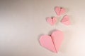 Pink origami hearts on a paper background