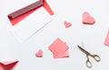 Pink origami hearts and red paper envelope with white blanks. Valentine\'s day concept card. Royalty Free Stock Photo