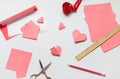Pink origami hearts and red paper envelope with white blanks. Valentine\'s day concept card. Royalty Free Stock Photo
