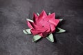 Pink Origami Lotus Flower - Paper Art on Textured Background Royalty Free Stock Photo