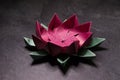 Pink Origami Lotus Flower - Paper Art on Textured Background Royalty Free Stock Photo