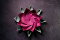 Pink Origami Lotus Flower - Paper Art on Textured Background Royalty Free Stock Photo