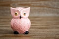 Pink Owl Figurine on Wooden Background Royalty Free Stock Photo