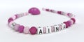 A pink pacifier chain for girls with name Aina