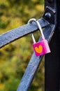 Pink padlock with heart on bridge in Kiev.