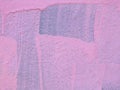 Pink paint on a wall with drips and brush marks with the original blue color showing underneath Royalty Free Stock Photo