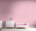 Pink painted bedroom with a cradle and furniture