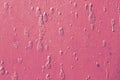 Pink painting on rusty metal surface Royalty Free Stock Photo