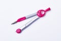 Pink pair of drawing compasses. Royalty Free Stock Photo