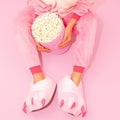 Pink Pajamas Party Girl concept. Stay Home. Popcorn lover. Minimal. Home Relax Cinema style Royalty Free Stock Photo