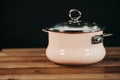 Pink pan on a wooden table.