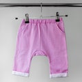 Pink panties for baby. The concept of clothes, motherhood and newborn