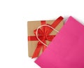 Pink paper bag with a gift box on a white background Royalty Free Stock Photo