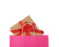 Pink paper bag with a gift box on a white background Royalty Free Stock Photo