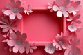 Pink paper flowers and leaves creating a frame around a rectangular empty space on a monochromatic background Royalty Free Stock Photo