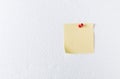 Pink paper note with pin on foam sheet Royalty Free Stock Photo