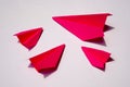 Pink Paper Plane or Paper Airplane Origami on white Background Top View with Place for Text, business competition Royalty Free Stock Photo