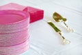 Pink paper plates gold cake knife