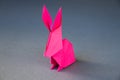 Pink paper rabbit origami isolated on a grey background Royalty Free Stock Photo