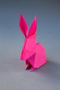 Pink paper rabbit origami isolated on a grey background Royalty Free Stock Photo