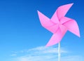 Pink paper windmill in the sky Royalty Free Stock Photo