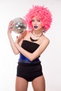 Pink party girl holding silver ball