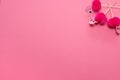 pink party toothpicks in a shape of flamingo on a pink background. origami Royalty Free Stock Photo