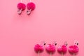 pink party toothpicks in a shape of flamingo on a pink background. origami Royalty Free Stock Photo