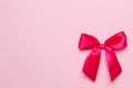 Pink pastel background and gift satin ribbon bow copyspace Royalty Free Stock Photo