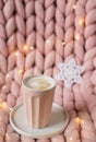 Pink pastel merino woolen giant blanket, gingerbread deer, cup with cappuccino, Christmas toy, New Year