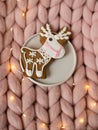 Pink pastel merino woolen giant blanket, gingerbread deer, cup with cappuccino, Christmas toy, New Year