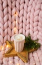 Pink pastel merino woolen giant blanket, gingerbread deer, cup with cappuccino, Christmas toy, New Year