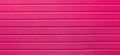 Pink pattern of horizontal lines, covering, background, abstraction, close-up. Plastic fence. web panorama banner with copy space Royalty Free Stock Photo