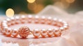 Pink pearl bracelet on pink table background