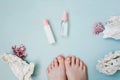 Pink pedicure on a blue background. Top view. Royalty Free Stock Photo