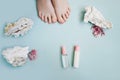 Pink pedicure on a blue background. Top view. Royalty Free Stock Photo
