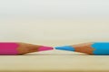 Pink pencil against blue pencil - Concept of gender struggles Royalty Free Stock Photo